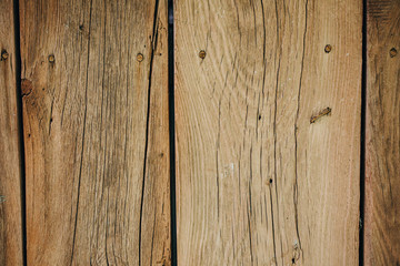 Rough wooden vertical planks background. Old rustic texture of the door.