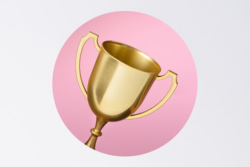 Photo of trophy cup golden through paper cut layered window