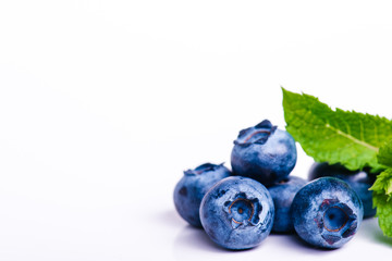 Fresh sweet blueberry fruit and leaf of mint.