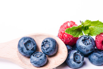 Fresh sweet blueberry fruit and leaf of mint.