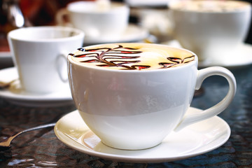 Cup of coffee on the table. Retro vintage effect picture.