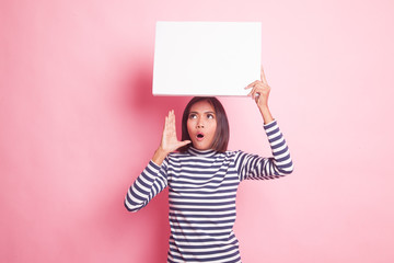 Young Asian woman surprise with white blank sign.