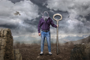 Man with keyhole instead of a head holds large key