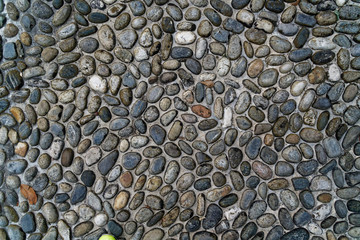 Pebbles ancient floor background,closeup big stones.