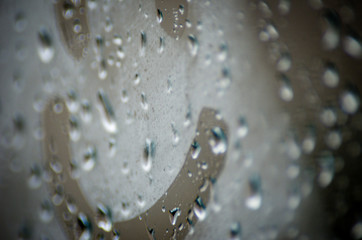 Positive Attitude Concept: Happy Smile Emoji On The Foggy Window With Water Drops On A Rainy Day