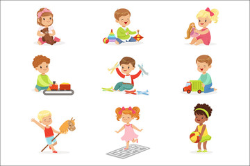 Cute Children Playing With Different Toys And Games Having Fun On Their Own Enjoying Childhood.