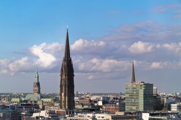 The Church of St. Nicholas in Hamburg, Germany against amazing cloudy sky