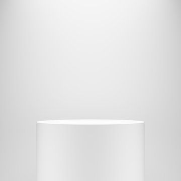 white blank empty cylinder pedestal template in front of white wall