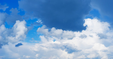 Naklejka na ściany i meble Blue sky background with clouds. Close up.