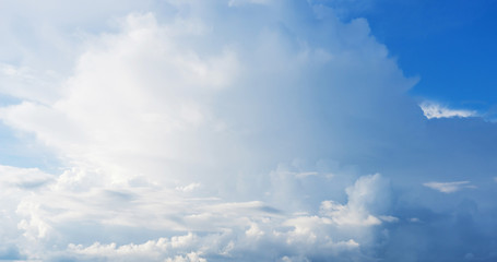 Blue sky background with clouds. Close up.