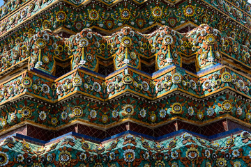 Close up beauitful mosaic tiles of large stupas in Wat Pho or Wat Phra Chetuphon Vimolmangklararm Rajwaramahaviharn is one of Bangkok's oldest temples