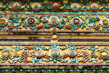 Close up beauitful mosaic tiles of large stupas in Wat Pho or Wat Phra Chetuphon Vimolmangklararm Rajwaramahaviharn is one of Bangkok's oldest temples