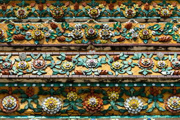 Close up beauitful mosaic tiles of large stupas in Wat Pho or Wat Phra Chetuphon Vimolmangklararm Rajwaramahaviharn is one of Bangkok's oldest temples