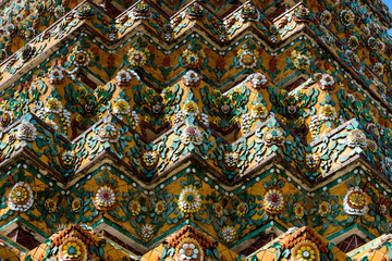 Close up beauitful mosaic tiles of large stupas in Wat Pho or Wat Phra Chetuphon Vimolmangklararm Rajwaramahaviharn is one of Bangkok's oldest temples