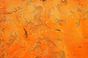 orange wall background with crack and old paint