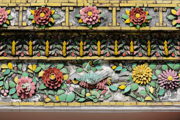 Close up beauitful mosaic tiles of large stupas in Wat Pho or Wat Phra Chetuphon Vimolmangklararm Rajwaramahaviharn is one of Bangkok's oldest temples