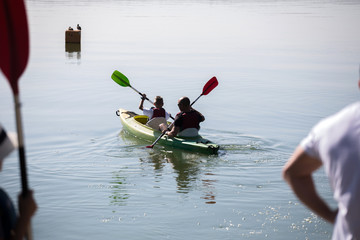 people enjoying kayaking on the river
