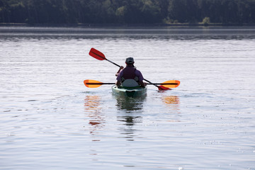people enjoying kayaking on the river
