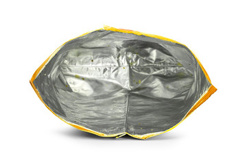 Potato chips bag isolated on white background. Inside of leftovers snack packaging.
