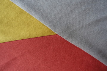 Fototapeta premium Pieces of yellow, orange and beige fabrics sewn together