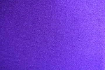 Texture of violet knitted fabric from above