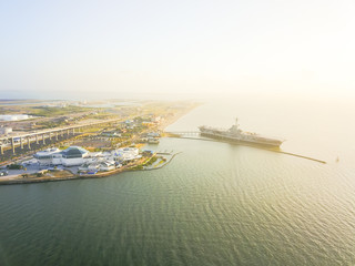 Naklejka premium Aerial view North Beach in Corpus Christi, Texas, USA with aircraft carrier ship