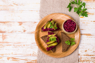 Sandwiches with beet and pickled cucumber