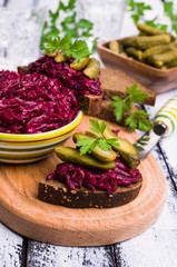 Sandwiches with beet and pickled cucumber