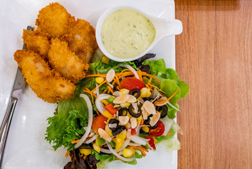 Healthy salad with mayonnaise and Fried prawn  on white dish