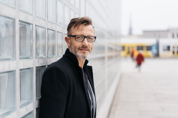 Attractive middle-aged man standing waiting