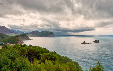 Fototapeta na wymiar Coastline near Petrovac and the islands Katic and Sveta Nedelja, Montenegro, Europe