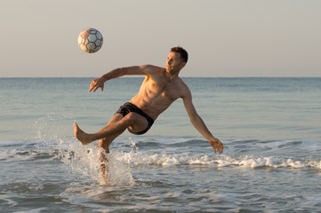 The guy in the sea plays with a ball