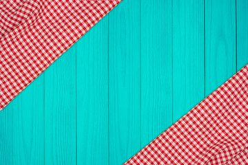 the checkered tablecloth on wooden table