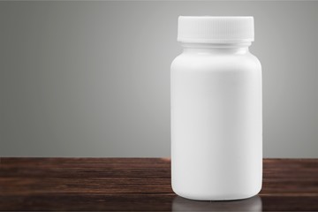 White medical container on white background