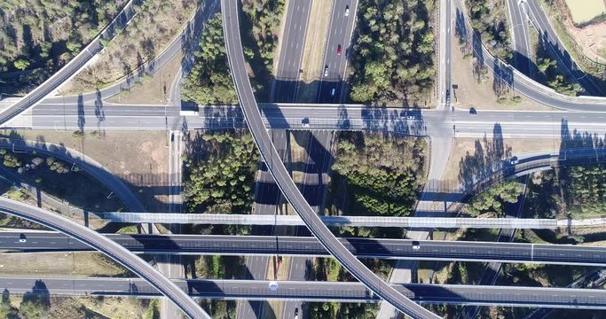 Overhead above Light horse interchange at intersection of M4 and M7 motorways in Sydney West with passing traffic and lots of lanes.
