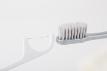 Toothbrush, dental floss. Dental Care Concept.
