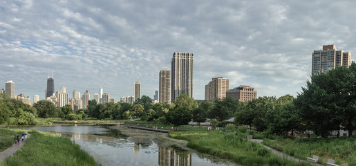 Fototapeta premium Chicago, Illinois/USA. July 9, 2018. Tall Building in Chicago reflecting in Park Pond.
