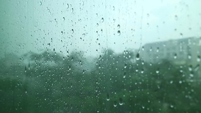 Rain drops on the window in rainy day. Soft focus.