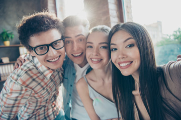 Self-portrait of four cheerful glad adorable people, handsome nerd guys and beautiful attractive girls having rest, pause, break at work, meeting, gathering
