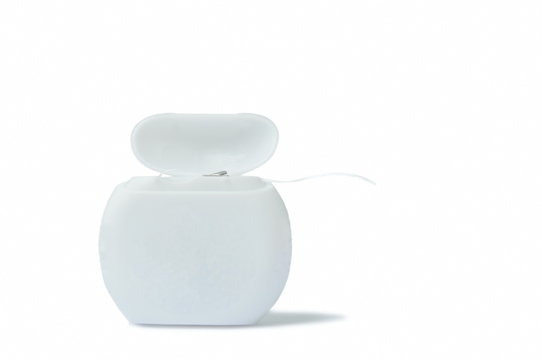 dental floss plastic packing on white background