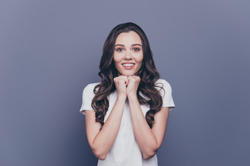 Attractive pretty nice adorable cheerful stylish pleased curly-haired girl in white t-shirt,...