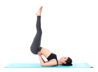 Fototapeta premium Young woman practicing yoga on white background