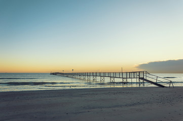 Fototapeta premium Sandy beaches of Rimini shortly after dawn in winter