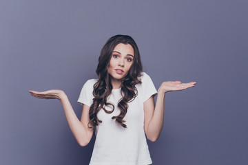 Portrait of magnificent lovely adorable gorgeous stylish nice confused curly-haired girl in casual...