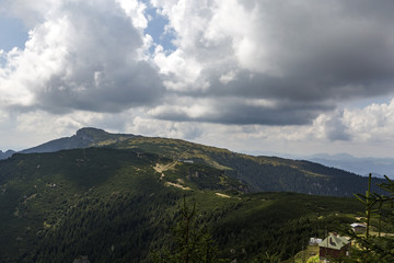 Fototapeta na wymiar View of the Ocolasul Mare peak from the Toaca peak in Romania Carpathians