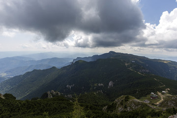 Fototapeta na wymiar View of the Ocolasul Mare peak from the Toaca peak in Romania Carpathians