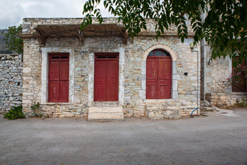 Stone house with red doors