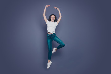 Graceful adorable pretty stylish trendy nice lovely cheerful curly-haired brunette girl in casual...