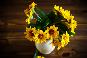 bouquet of yellow big daisies on a black