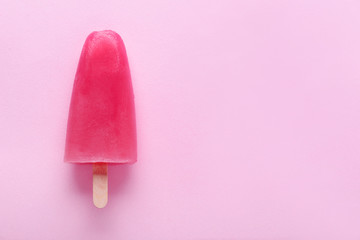 Tasty strawberry ice-cream on color background